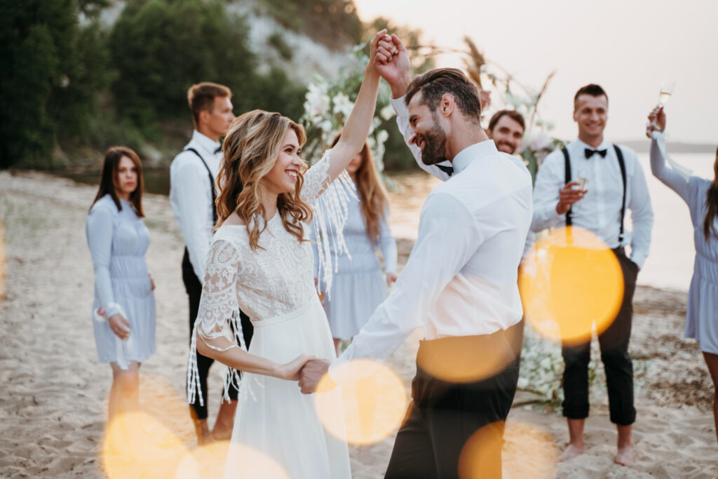bride groom having their wedding with guests beach